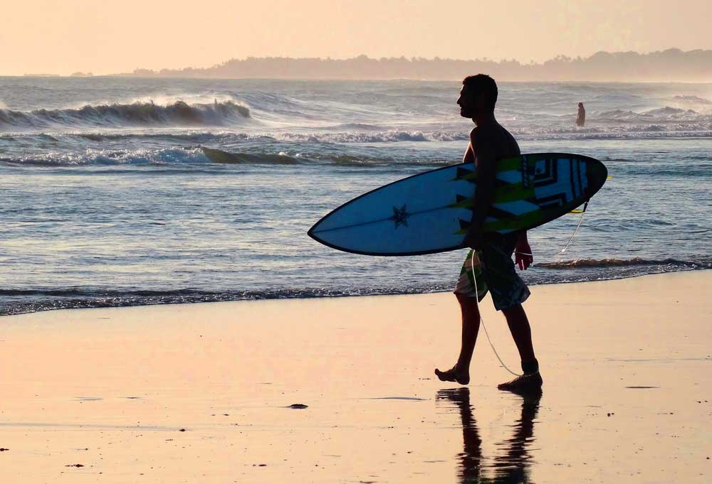 Surfer in Bali beach